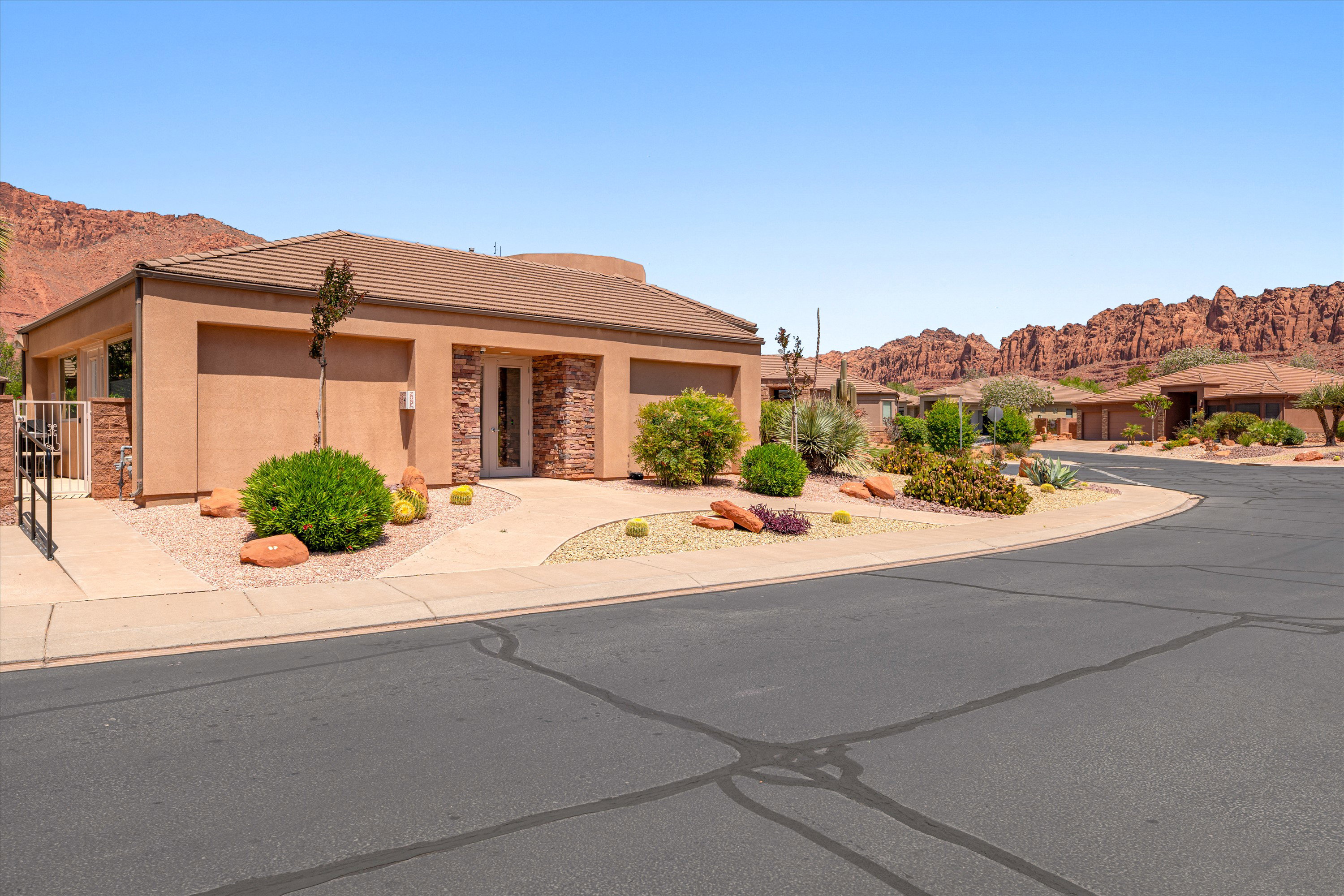 Single-story property with a stucco exterior and tile roofing