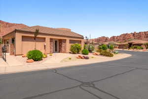 Single-story property with a stucco exterior and tile roofing