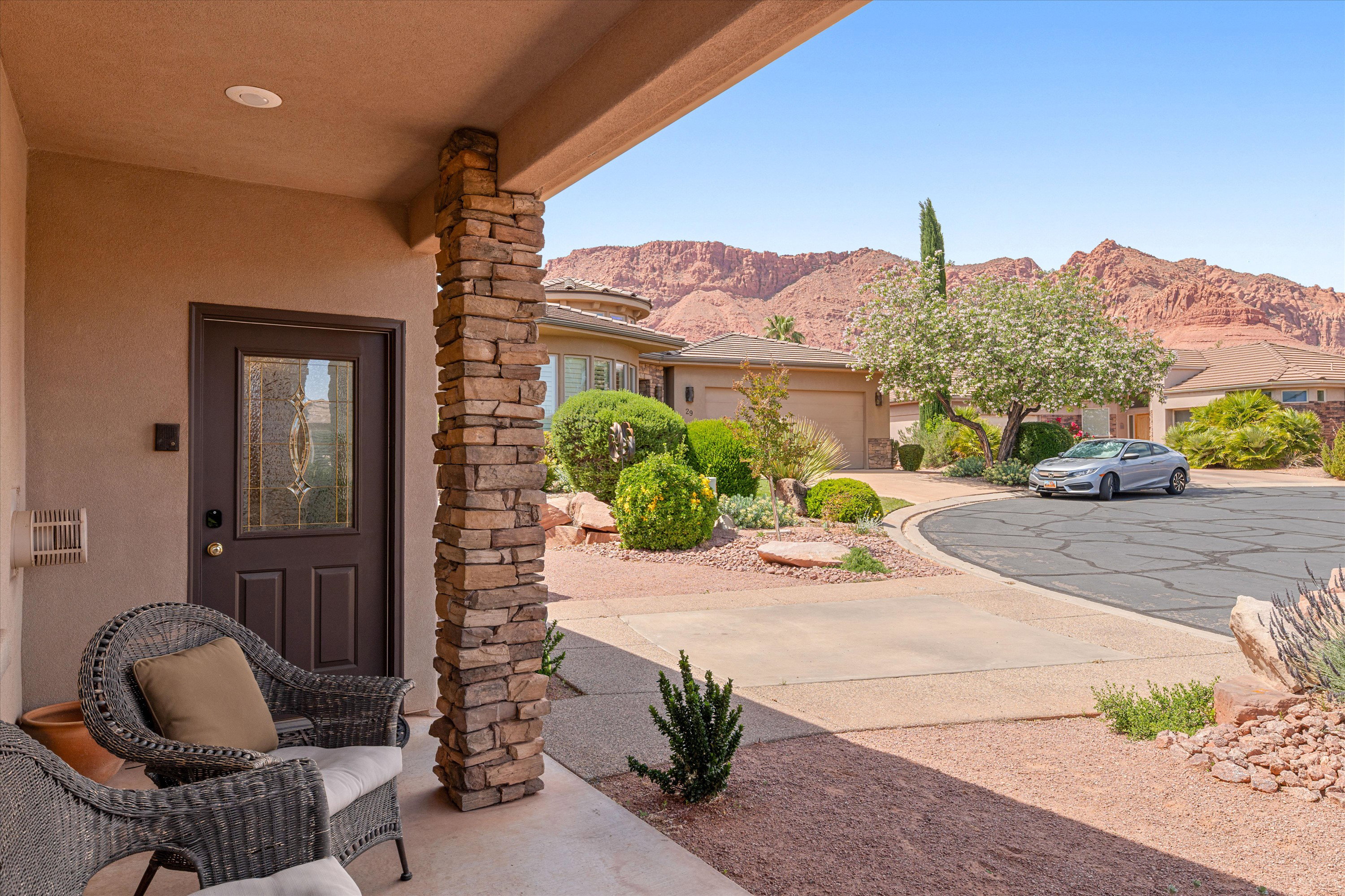 Doorway to property featuring stucco siding and a mountain view