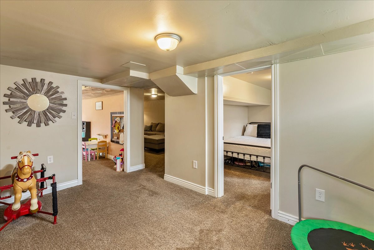 Recreation room with carpet and baseboards