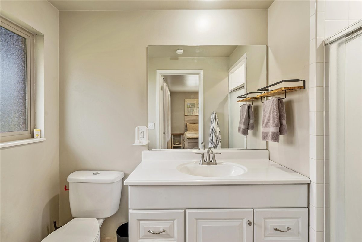 Ensuite bathroom featuring vanity and toilet