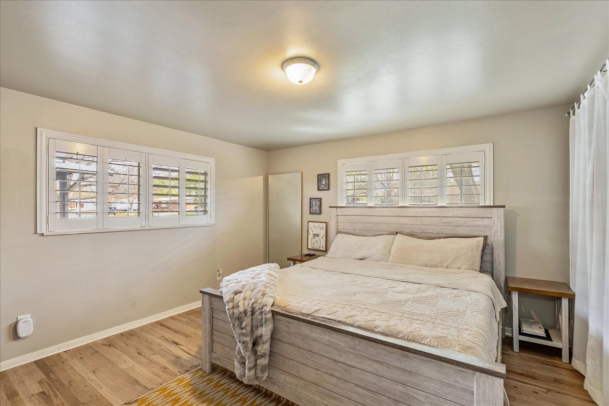 Bedroom featuring baseboards and light wood-style floors