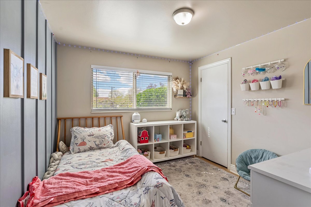 Bedroom with light wood-style floors