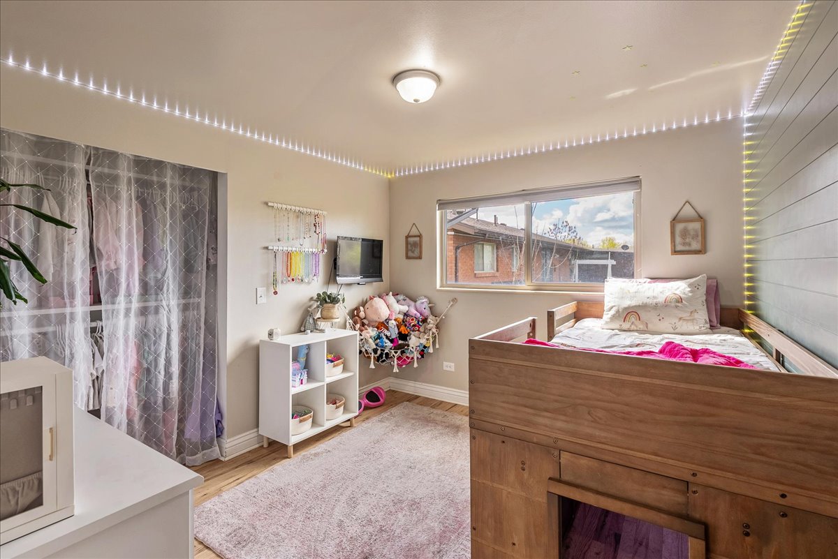 Bedroom with baseboards and light wood-style flooring