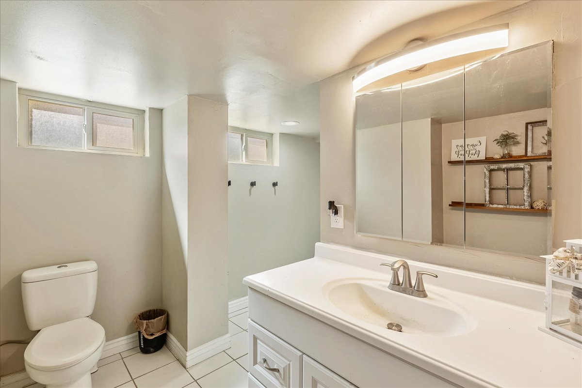 Bathroom featuring vanity and light tile patterned floors