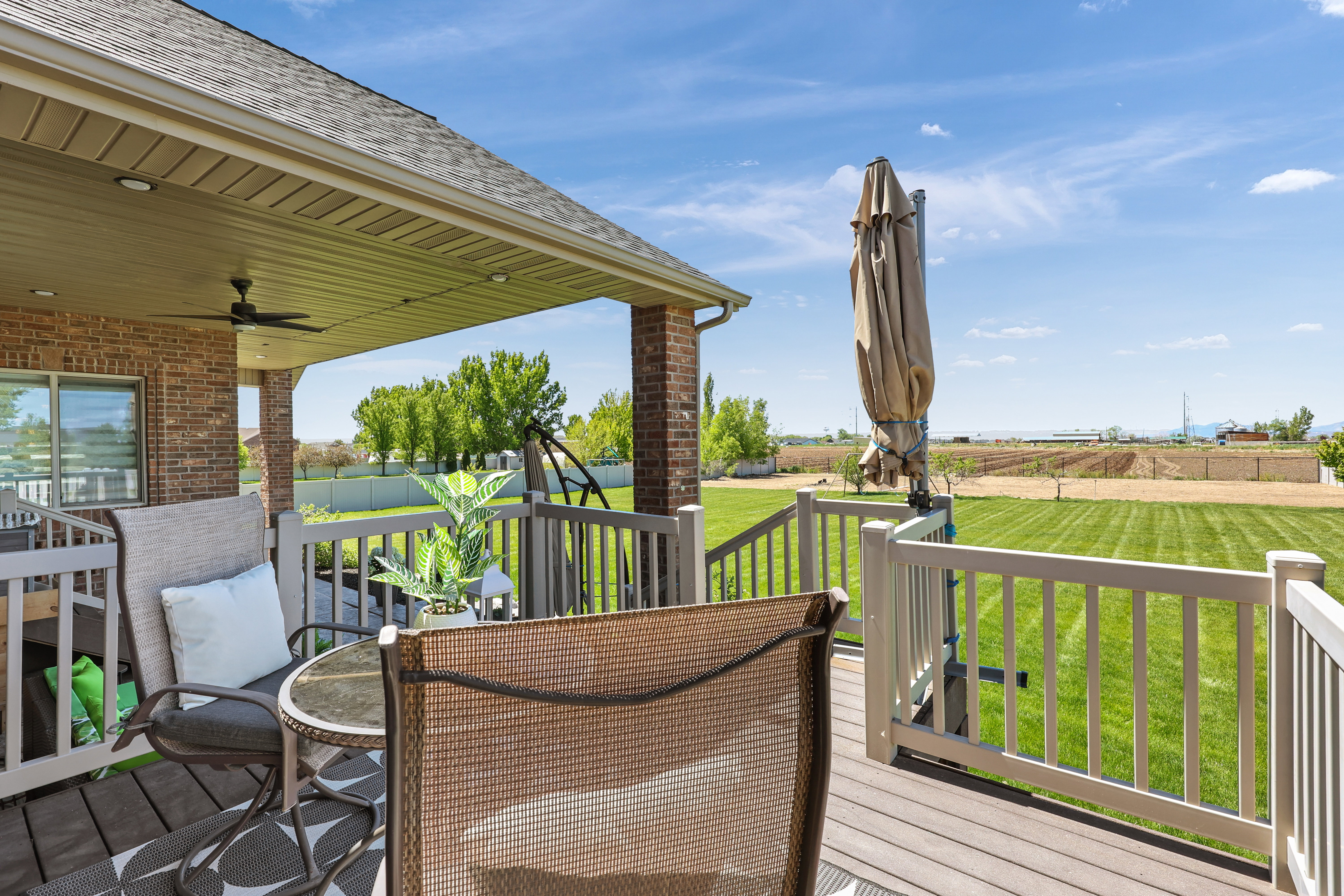 Deck featuring ceiling fan and outdoor dining area