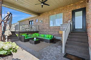 View of patio / terrace with outdoor furniture and a ceiling fan