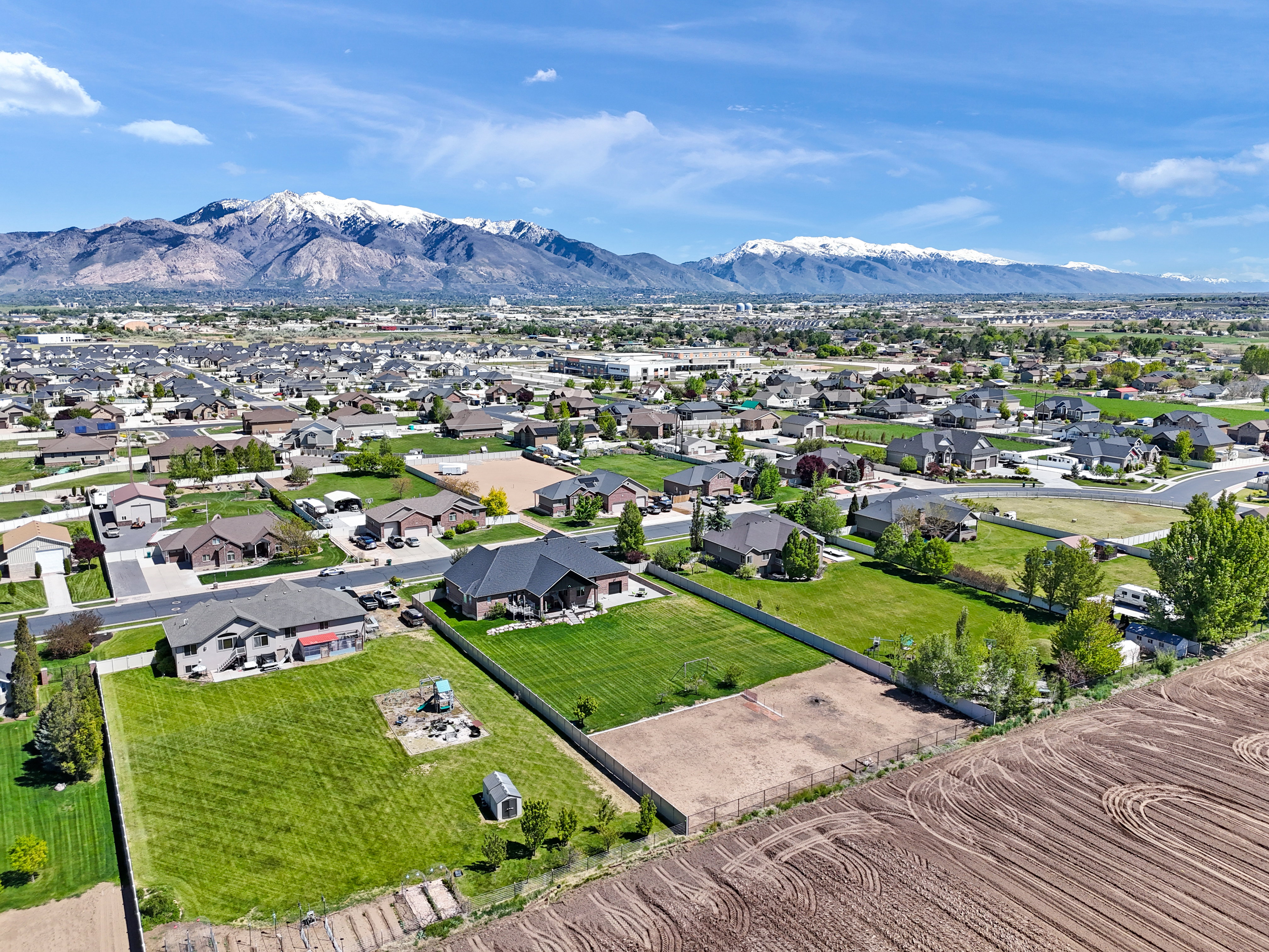 Aerial view of residential area featuring mountains