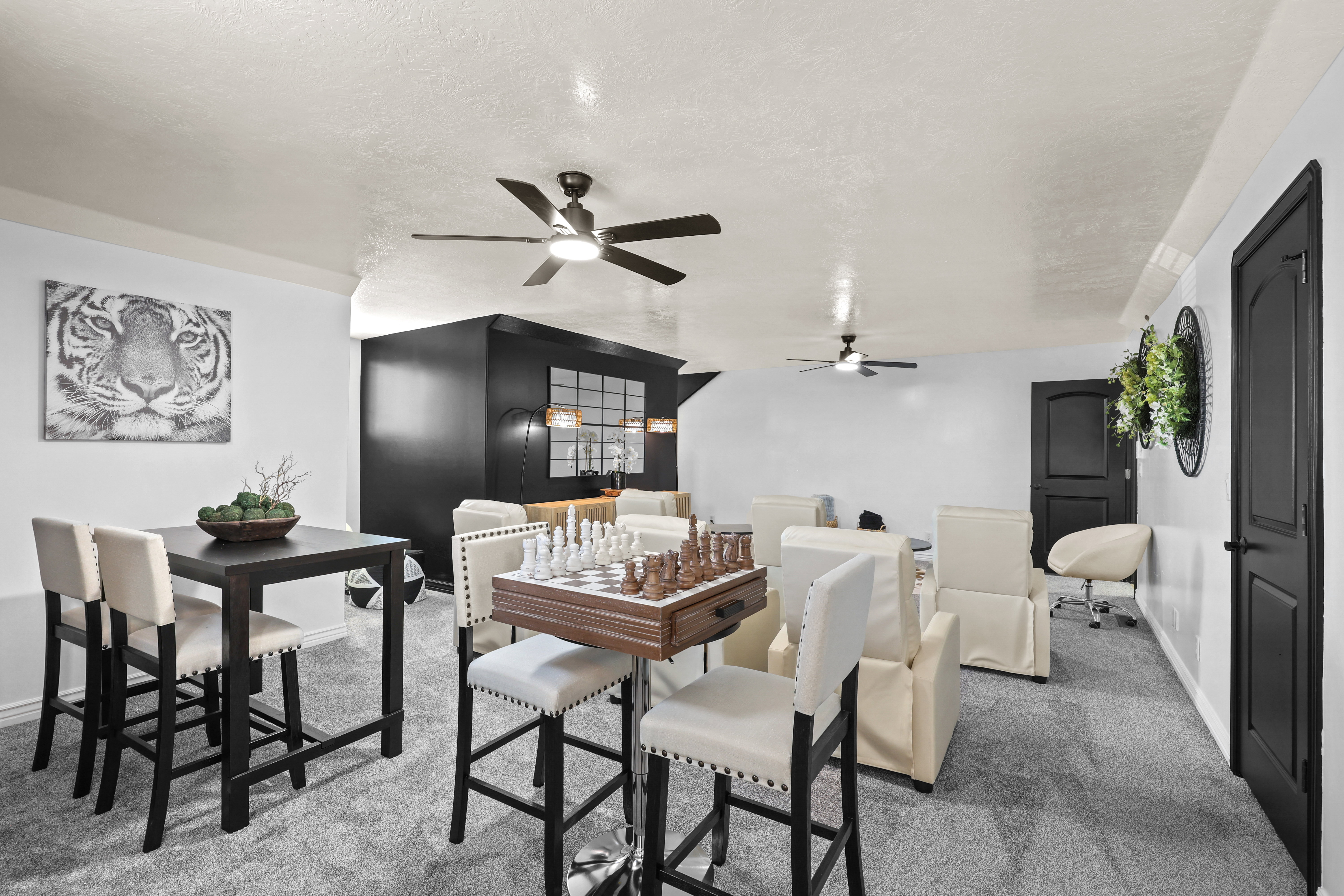 Carpeted dining space featuring baseboards and ceiling fan