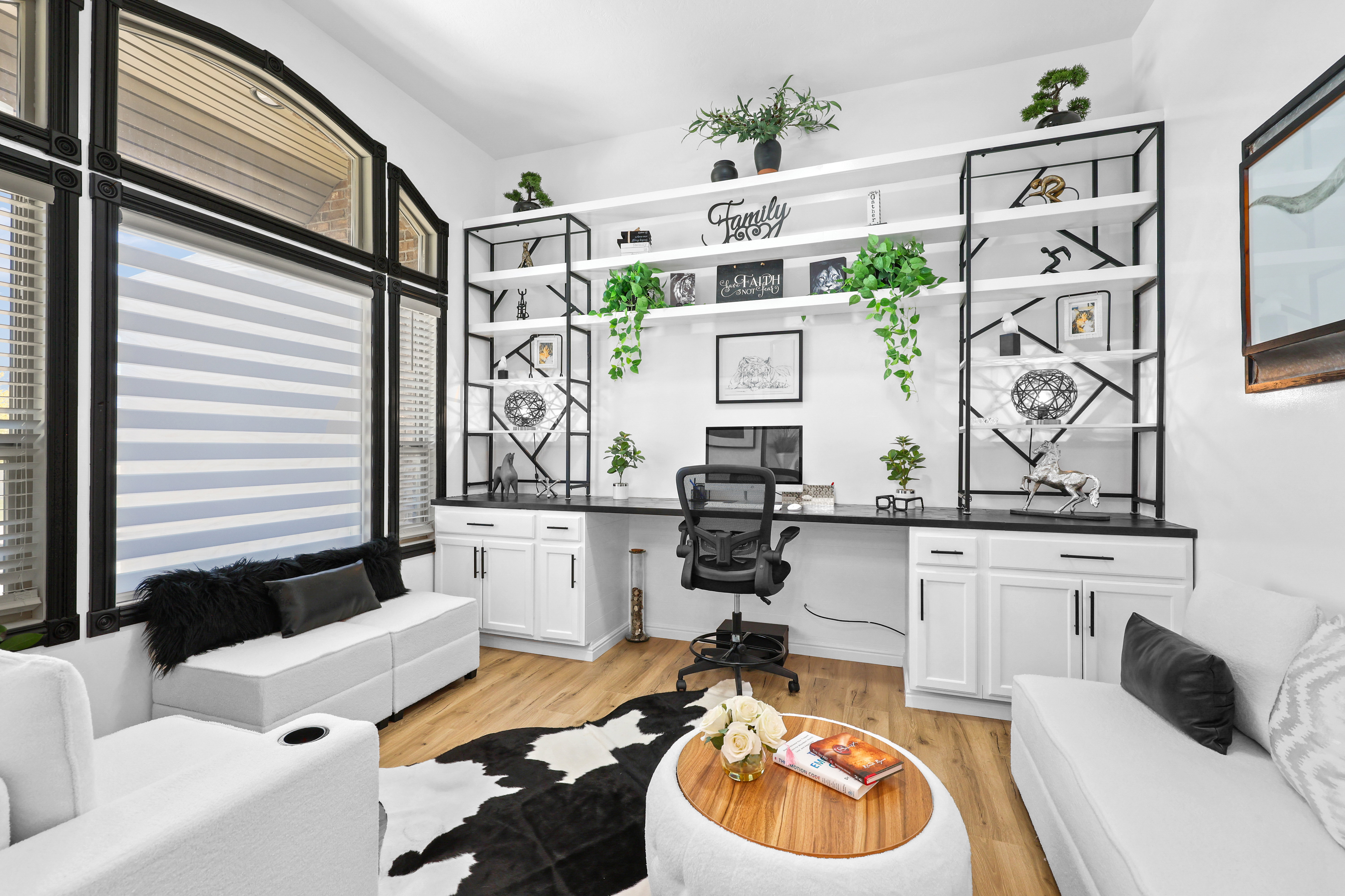 Office featuring built in study area and light wood finished floors