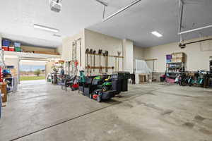 Garage featuring a garage door opener