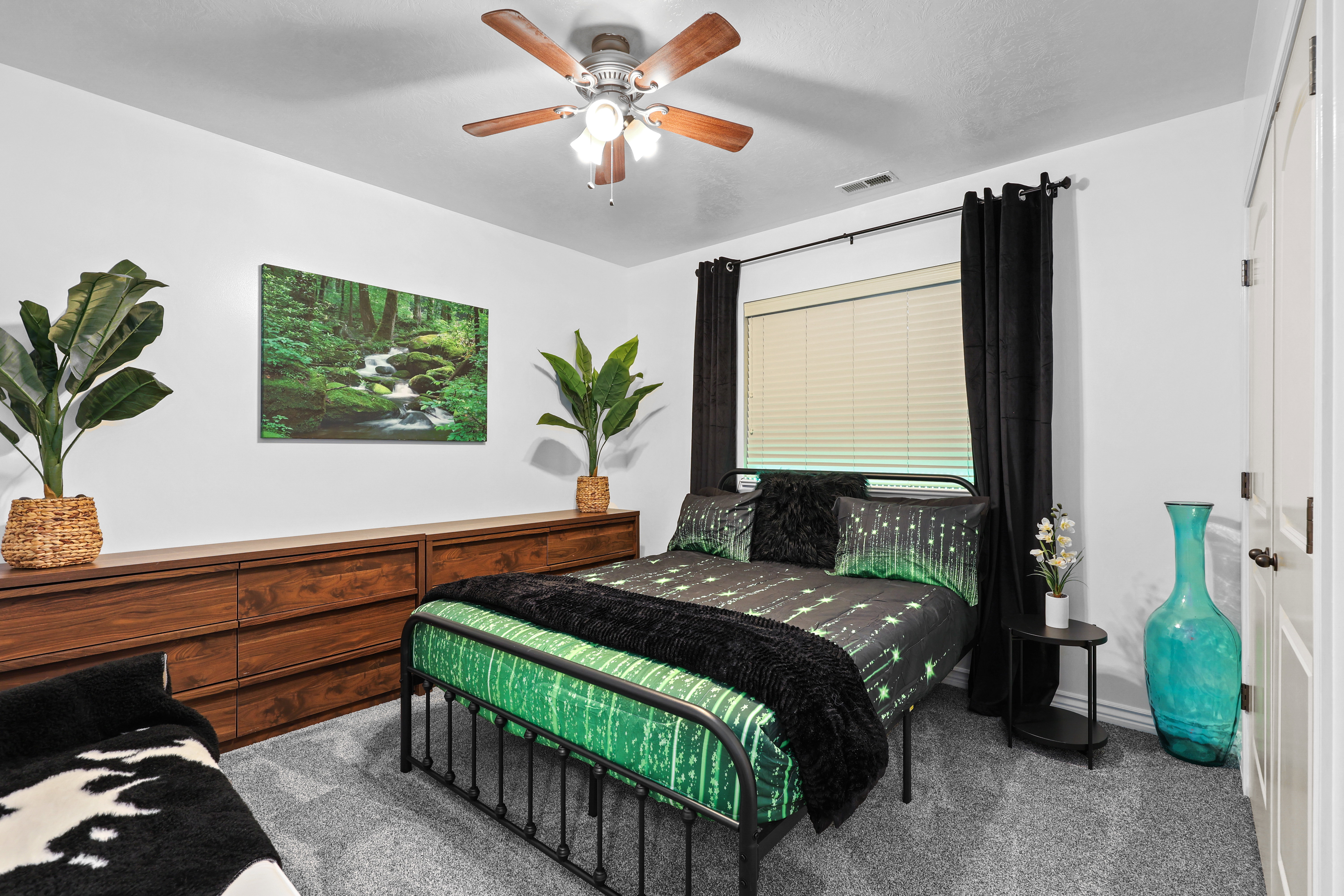 Bedroom featuring carpet flooring and ceiling fan