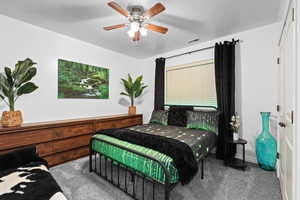 Bedroom featuring carpet flooring and ceiling fan