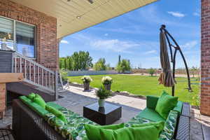 View of patio featuring an outdoor hangout area