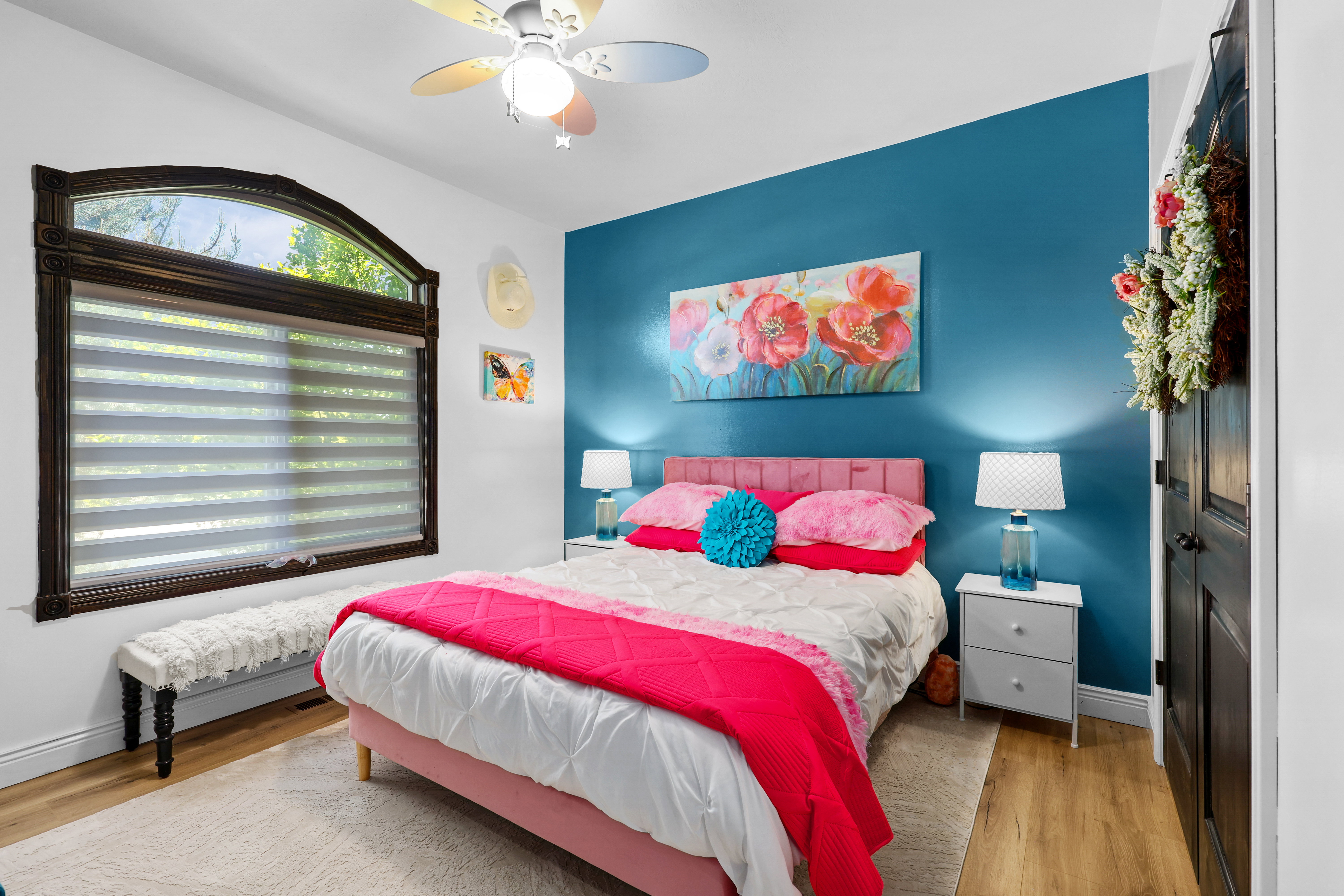 Bedroom featuring light wood finished floors and ceiling fan