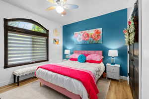 Bedroom featuring light wood finished floors and ceiling fan