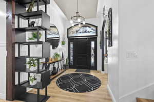 Entrance foyer featuring light wood-type flooring and suspended lighting