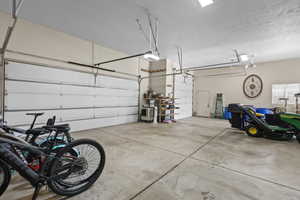 Garage featuring a garage door opener