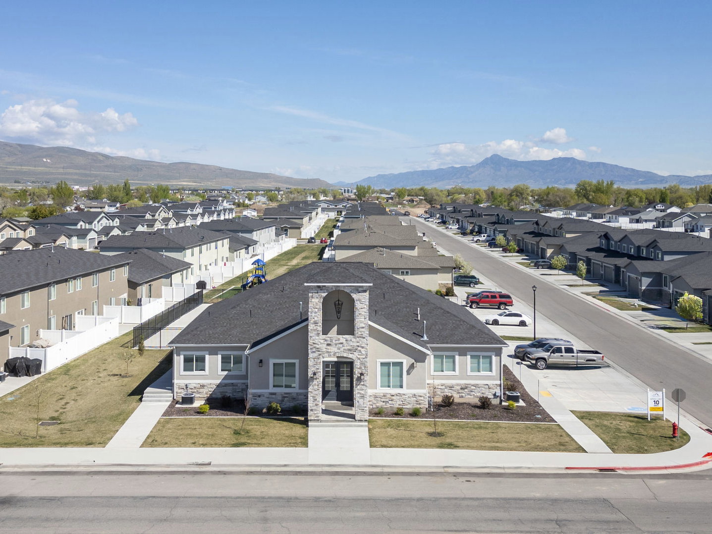 Aerial perspective of suburban area featuring a mountain backdrop