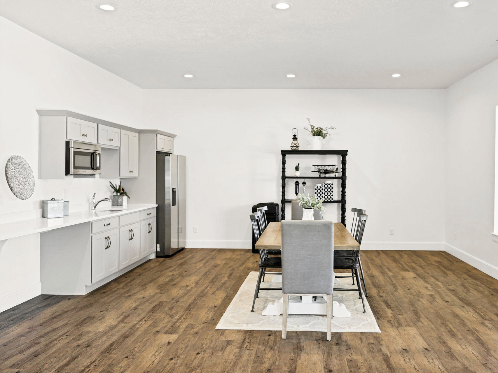 Dining room featuring dark wood finished floors and recessed lighting
