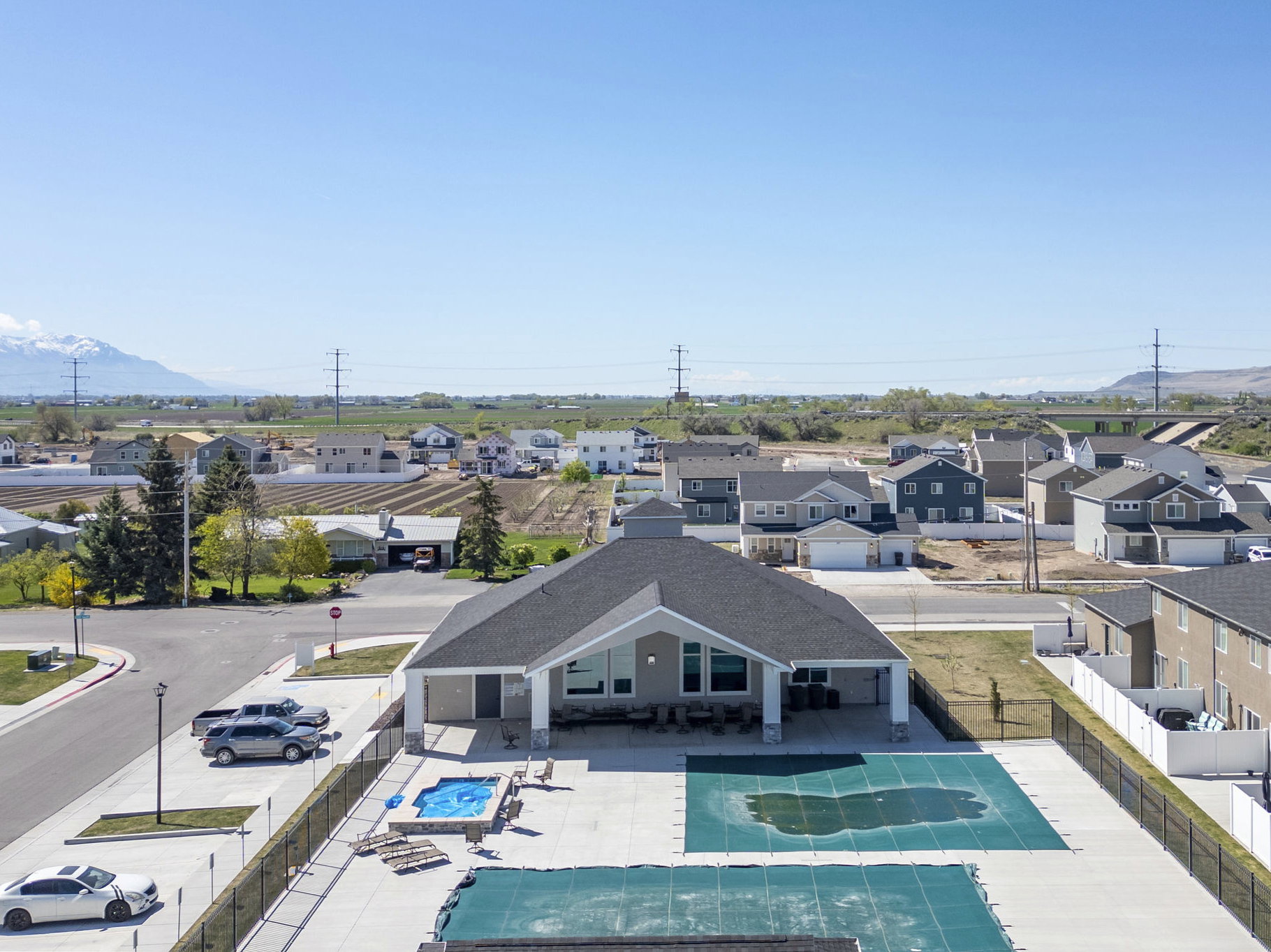Aerial view of residential area with a pool and mountains