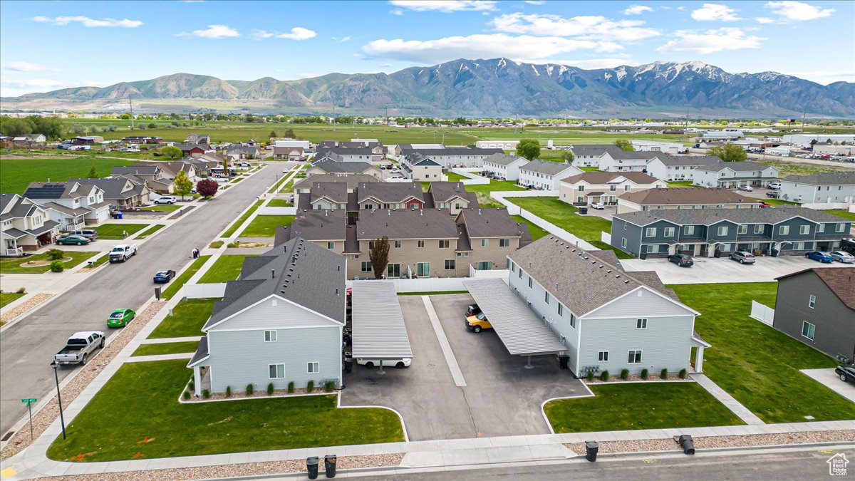 Aerial view of residential area featuring a mountain backdrop