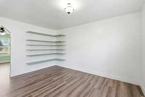 Spare room featuring light wood finished floors and baseboards