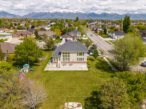 Aerial view of residential area featuring a mountainous background