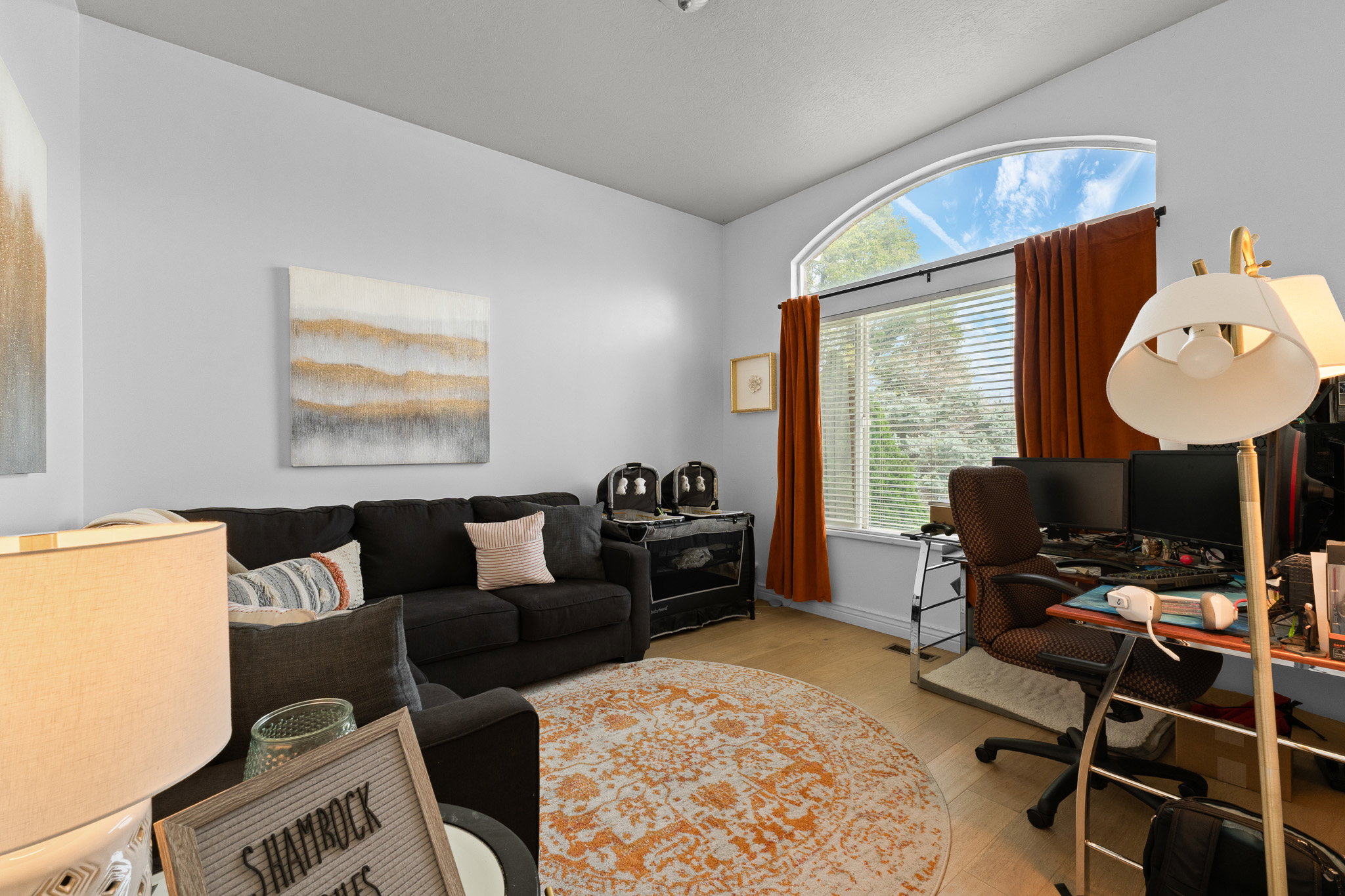 Office area featuring light wood-type flooring and baseboards