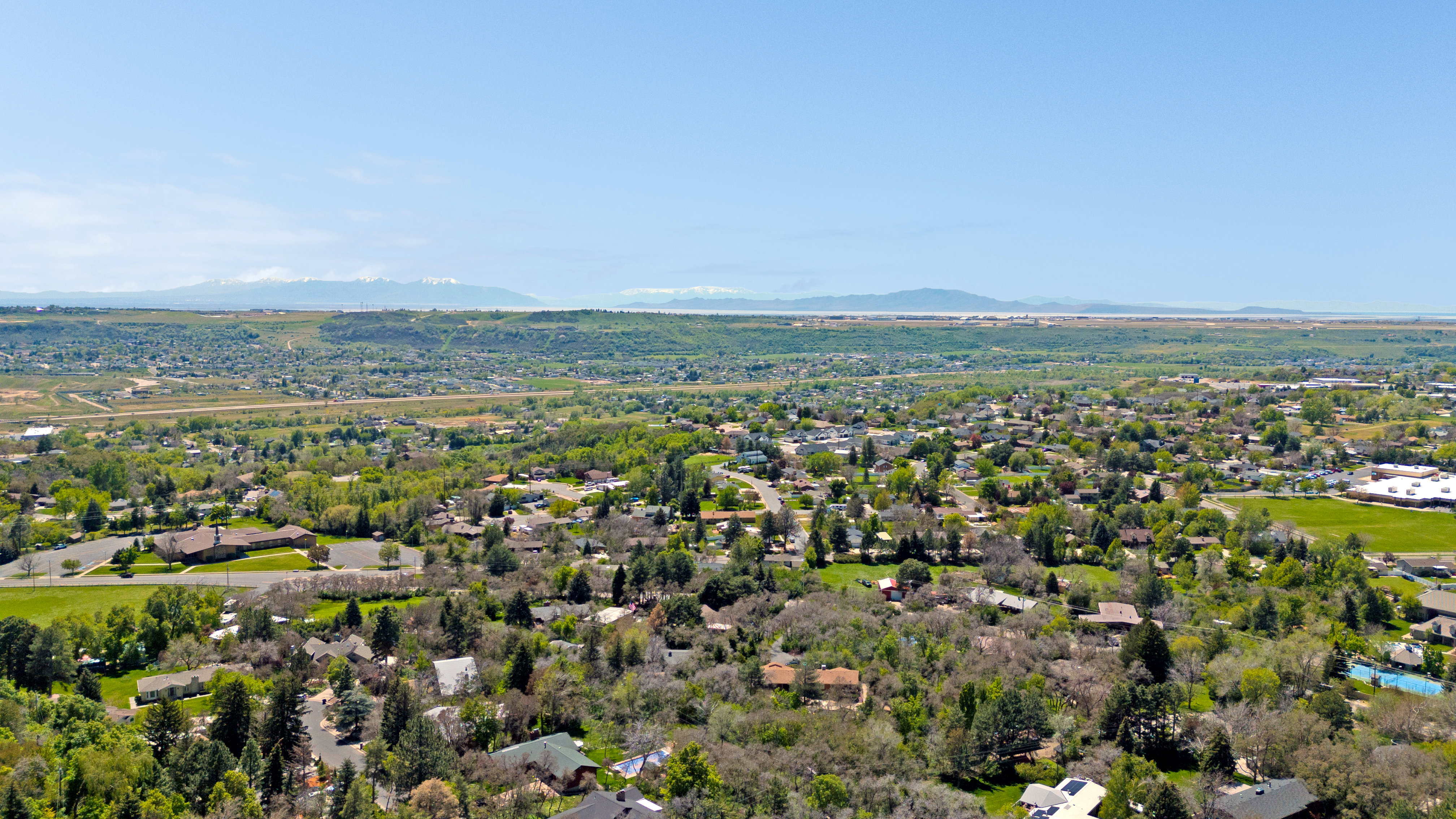 Aerial view of residential area with a mountain backdrop
