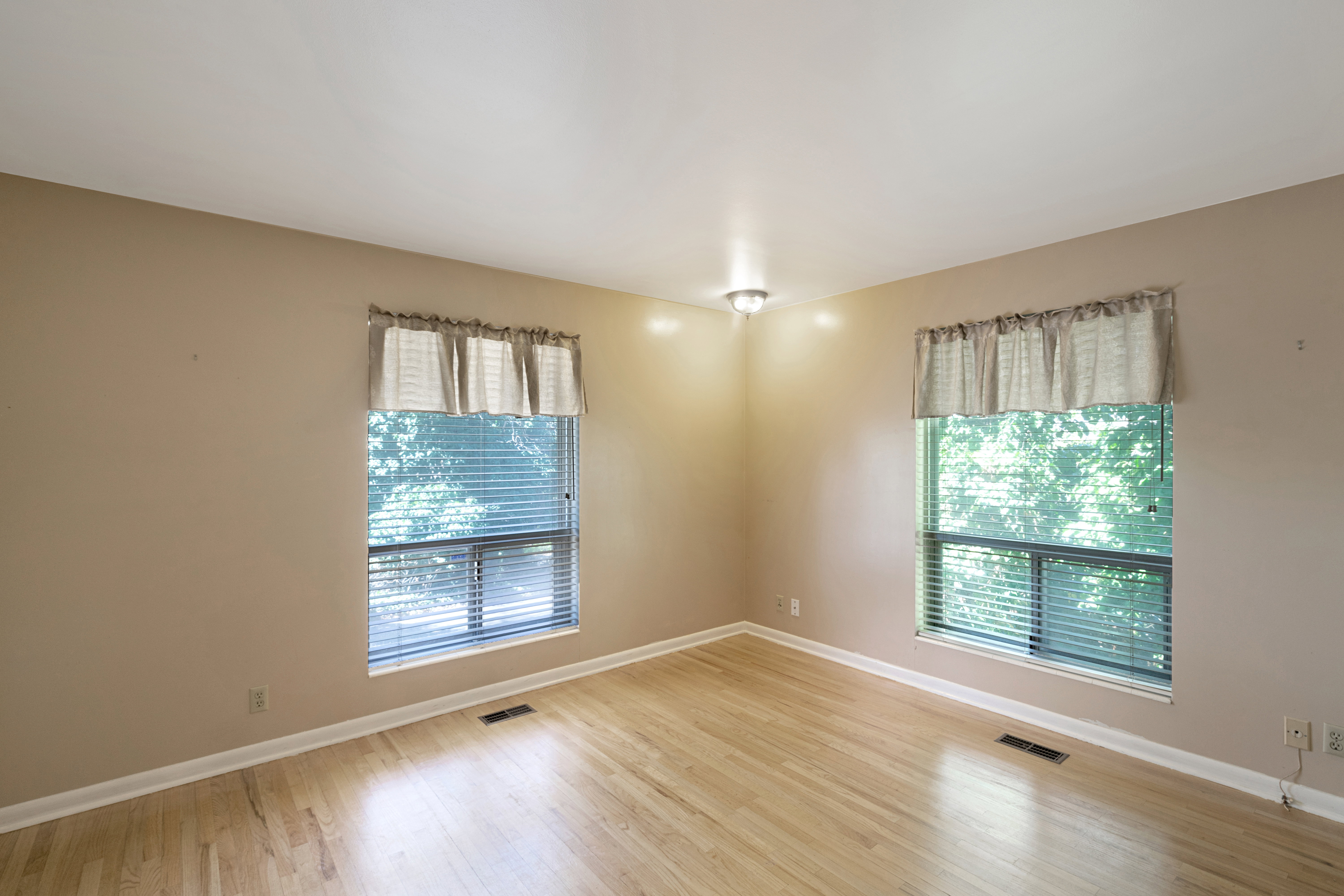 Unfurnished room with plenty of natural light and light wood-type flooring