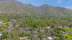 Aerial view of residential area featuring a mountain backdrop