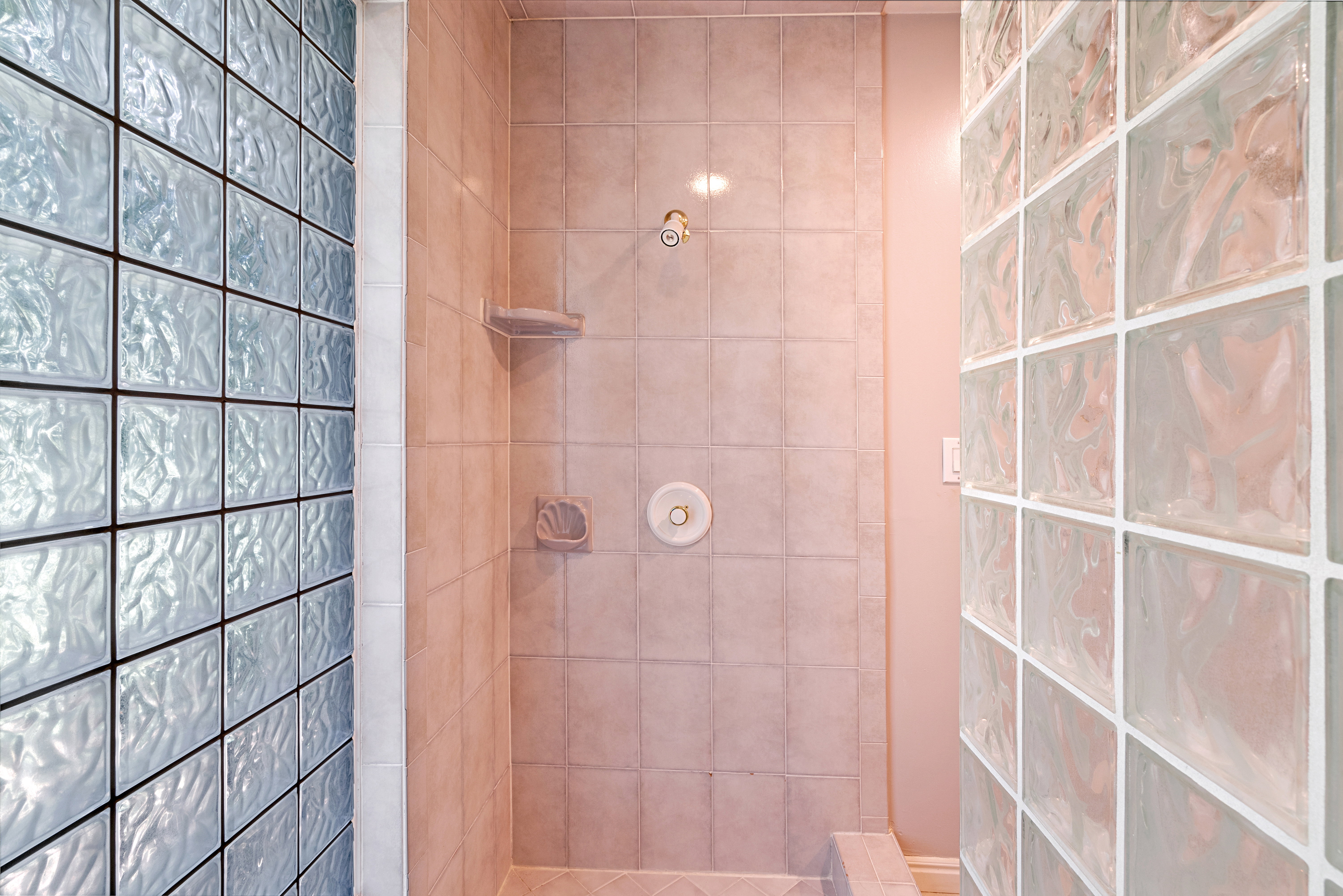 Bathroom featuring walk in shower