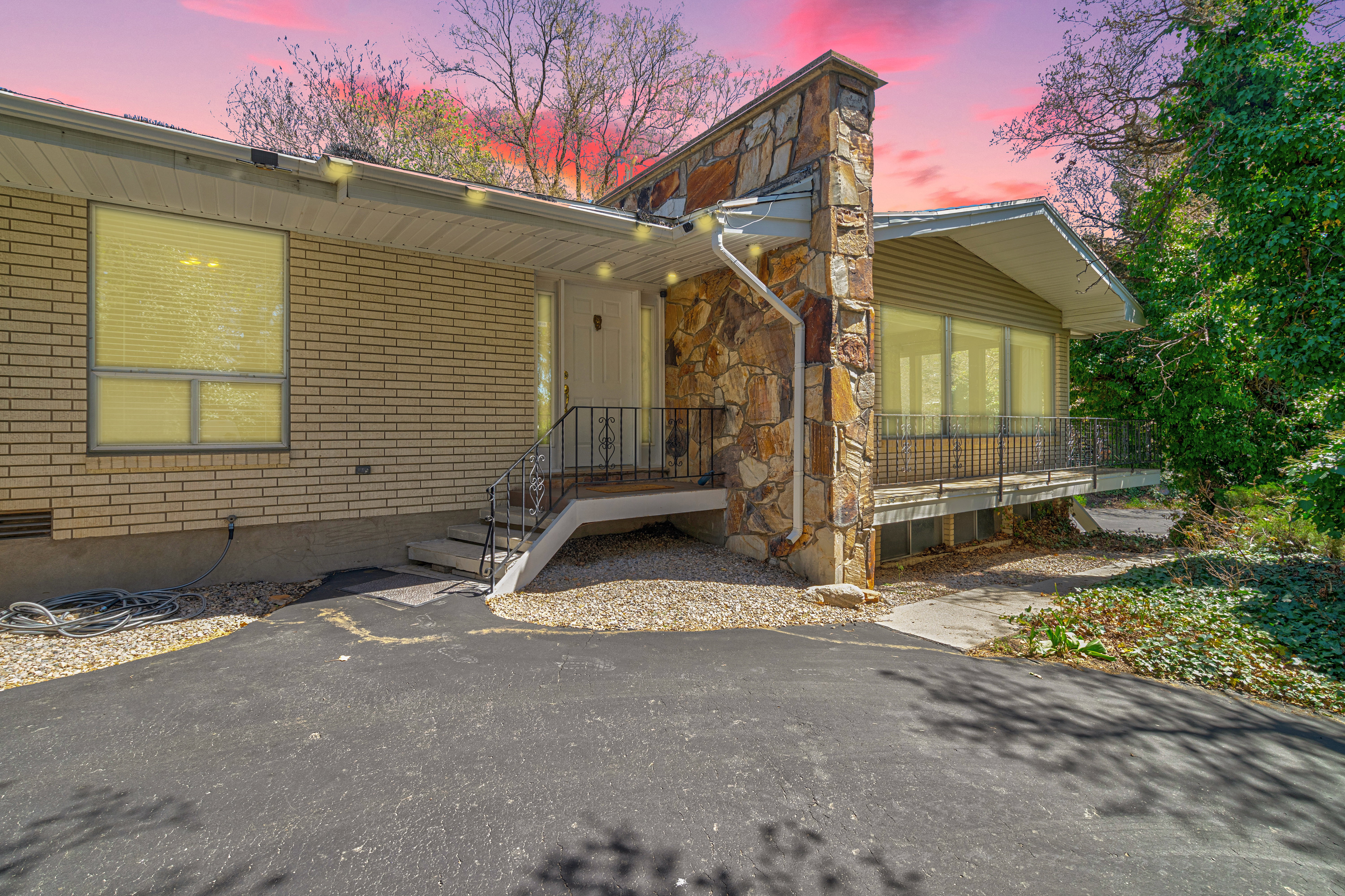 View of front of home featuring brick siding