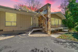 View of front of home featuring brick siding