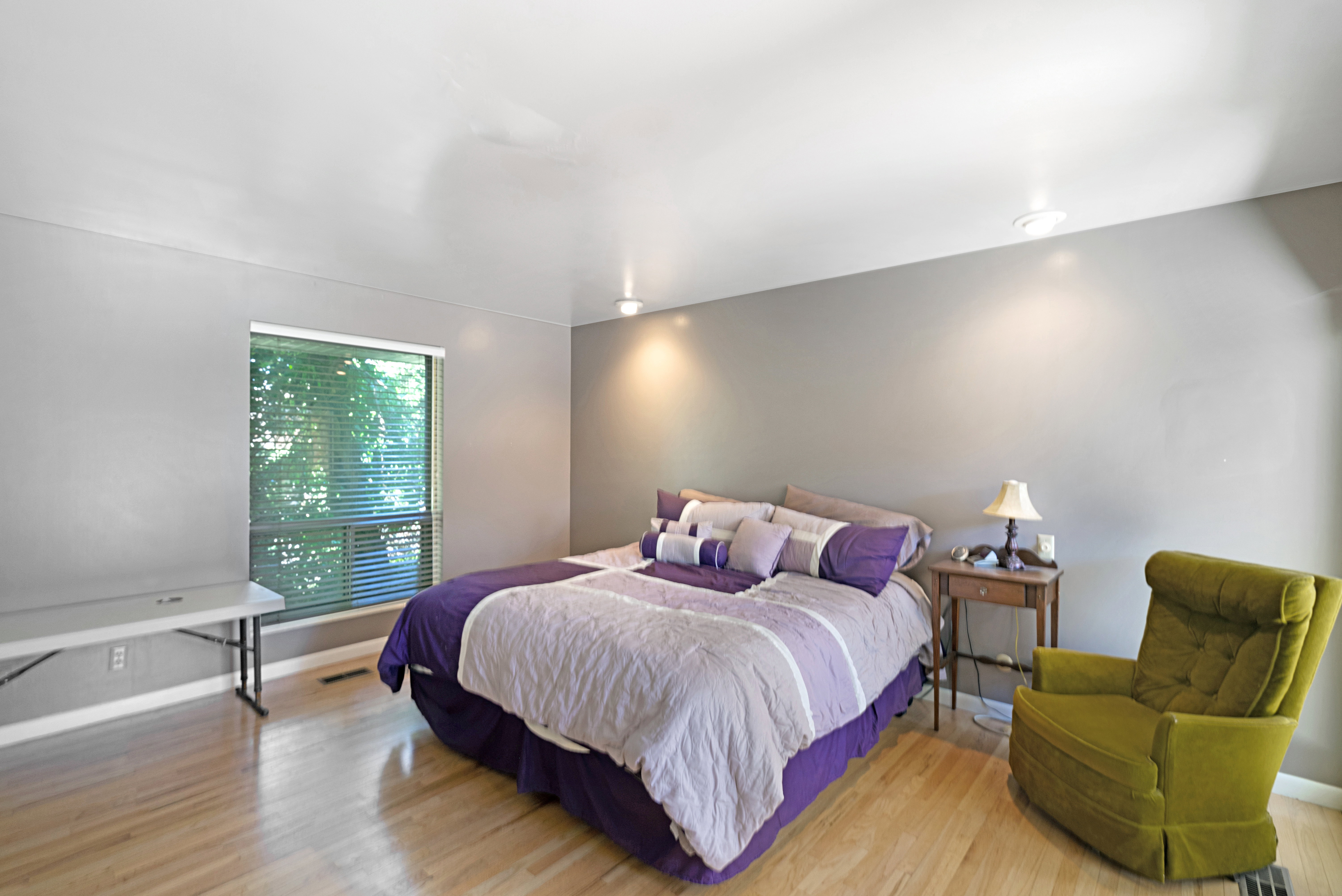 Bedroom with light wood-style flooring and baseboards
