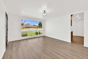 Spare room featuring light wood-style flooring