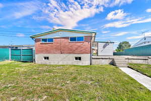 Back of property with brick siding