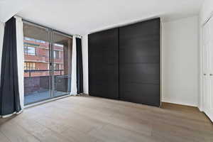 Expansive sliding glass doors opening to a private balcony