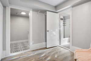 Living room with bathroom to the right, kitchen to the left