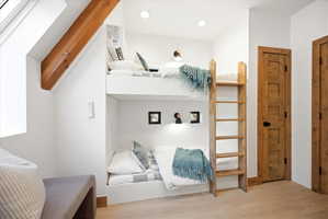 Built-in bunk beds with integrated ladder and individual reading lights