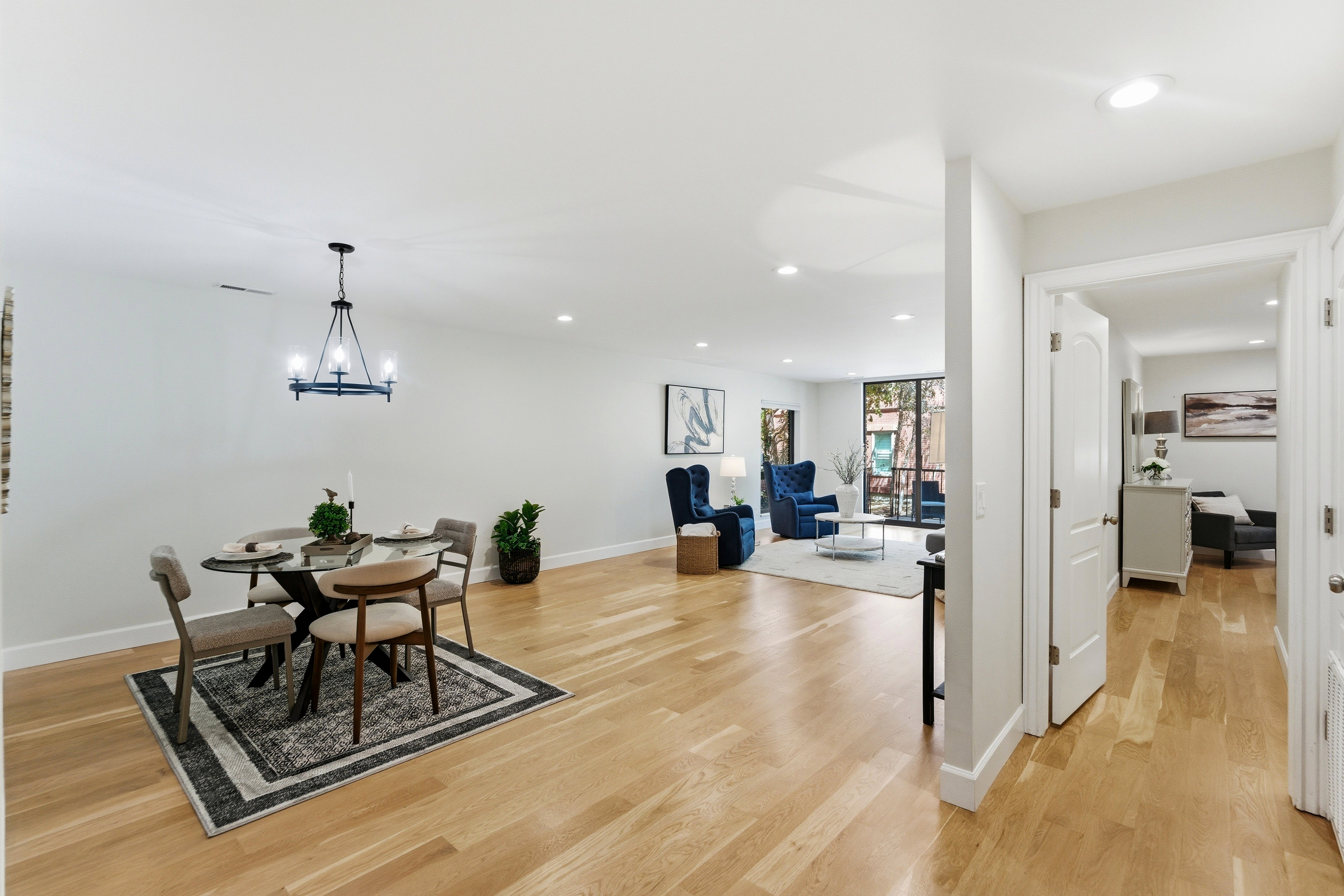 Hardwood flooring extends throughout this open-concept living space