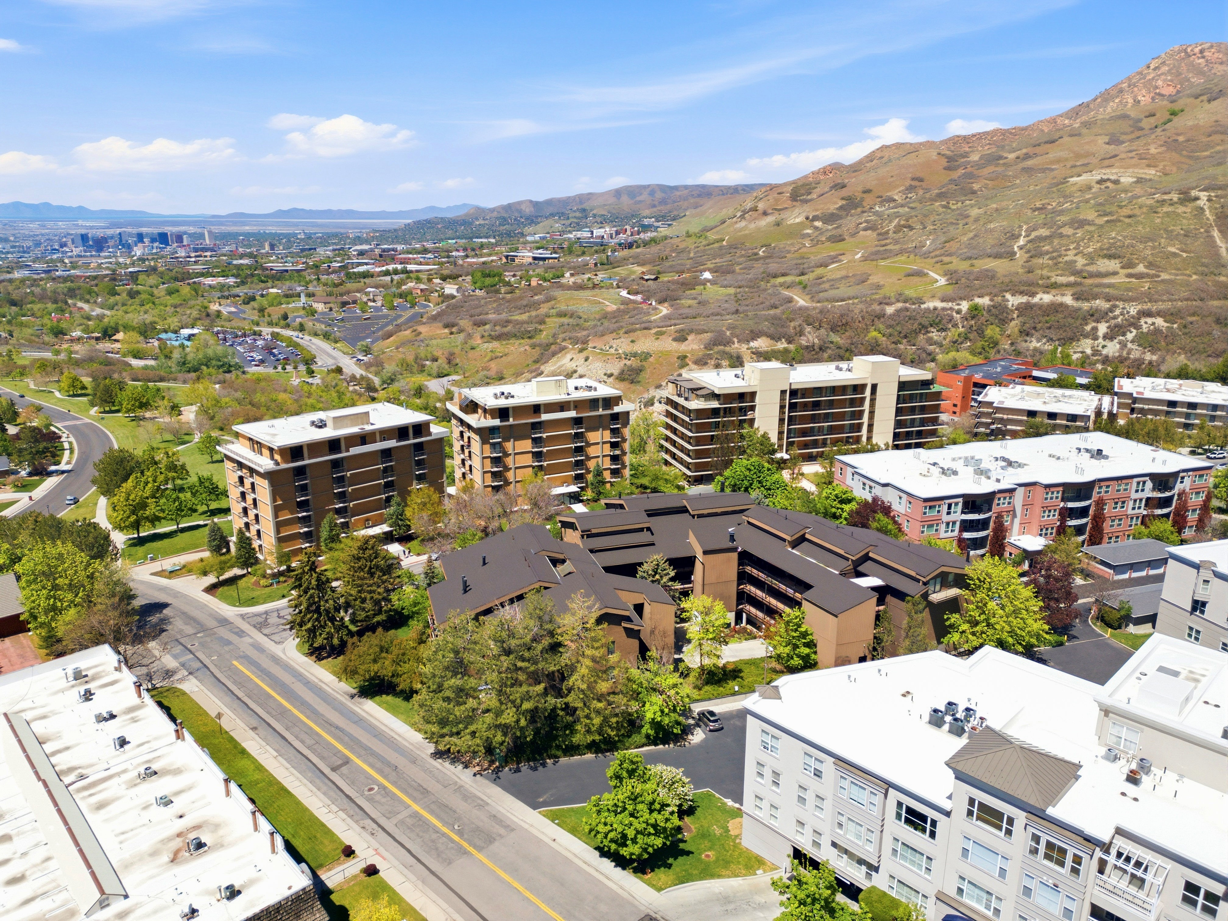 Aerial perspective showcasing multiple residential buildings with varied architectural styles