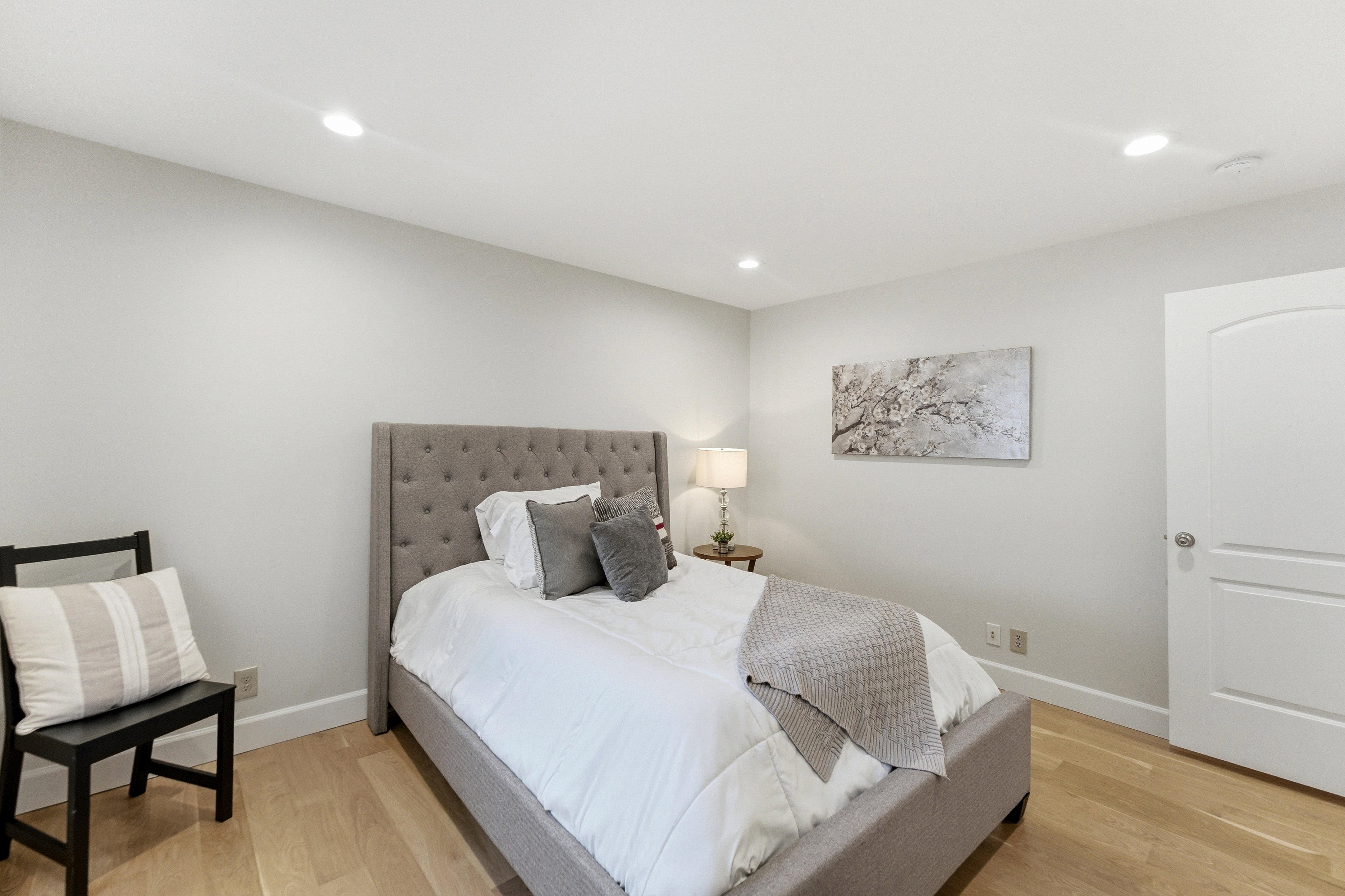 Room featuring light wood-finish flooring, recessed lighting, and a neutral wall color
