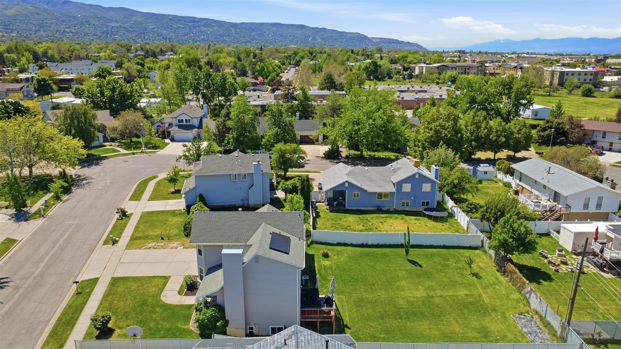Expansive residential neighborhood featuring detached homes and verdant landscaping