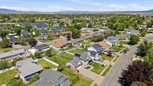 Residential neighborhood featuring mature trees and a clear sky