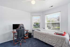 White walls with blue carpet flooring