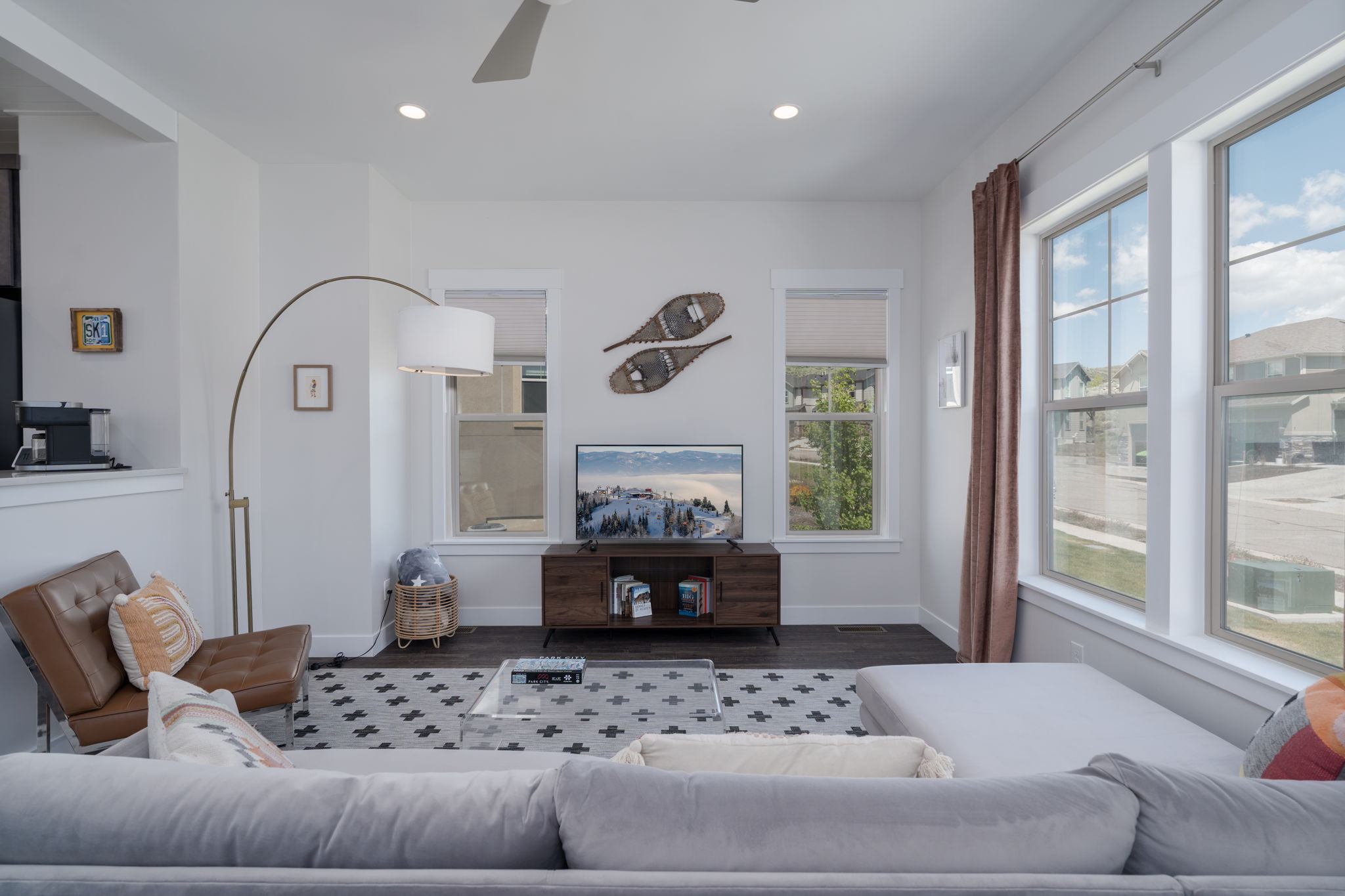 Living room featuring a ceiling fan, dark wood finished floors, and recessed lighting