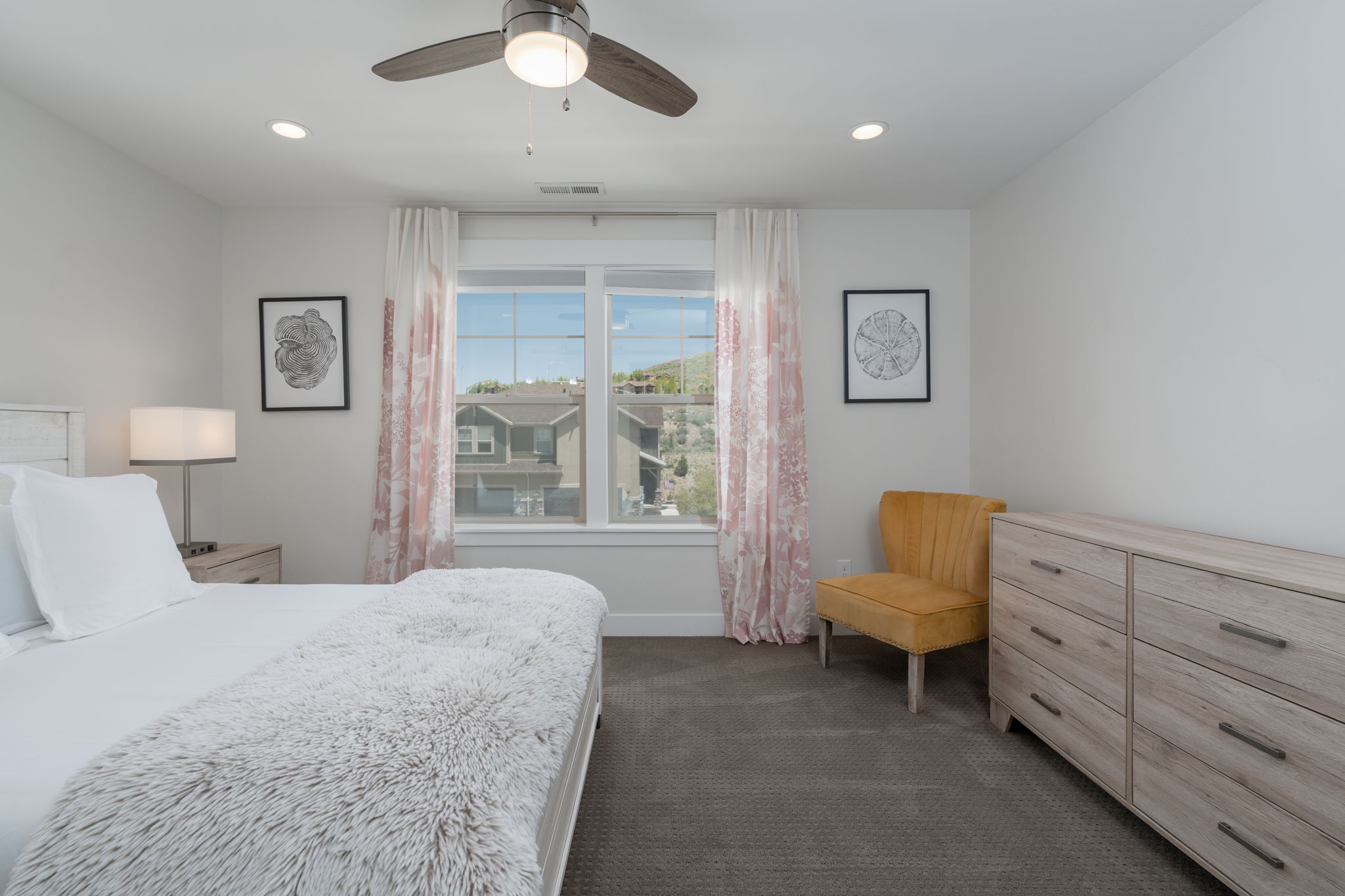 Bedroom featuring dark carpet, ceiling fan, and recessed lighting