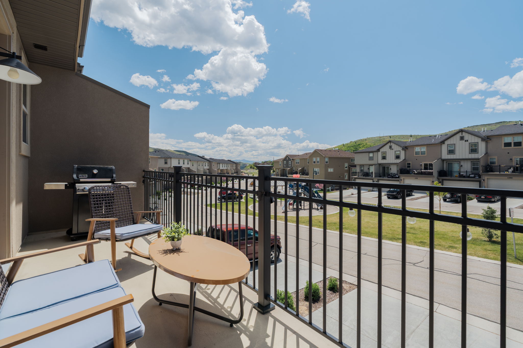 Balcony featuring a grill and a residential view